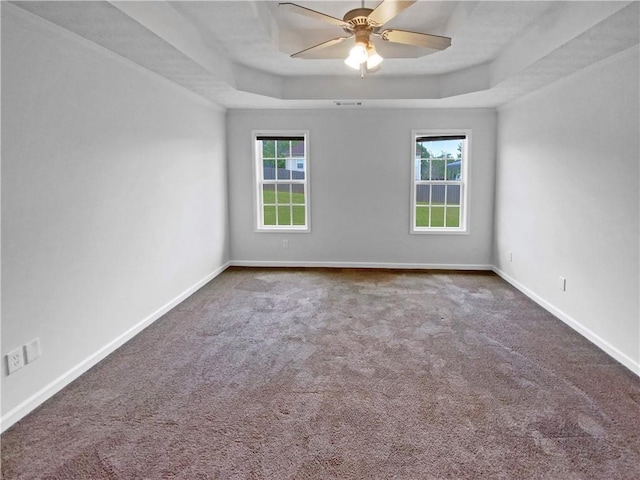 carpeted spare room with baseboards and a textured ceiling