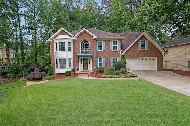 colonial home with brick siding, concrete driveway, a garage, and a front lawn