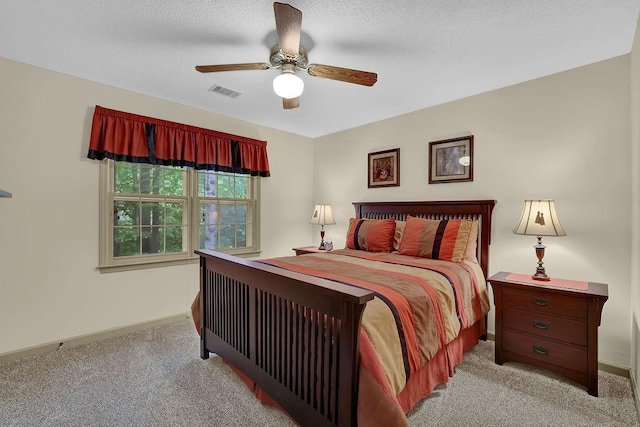 bedroom featuring light carpet, baseboards, and ceiling fan