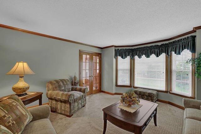 living area featuring light carpet, crown molding, baseboards, french doors, and a textured ceiling