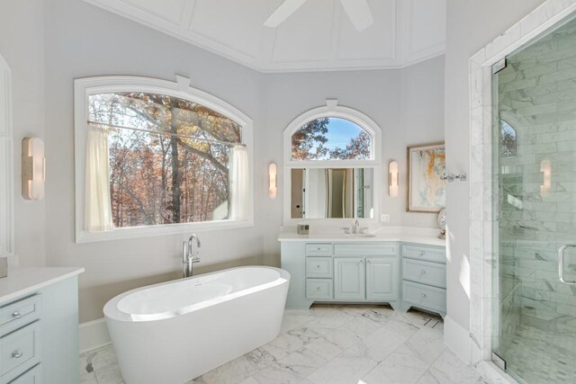 bathroom featuring vanity, separate shower and tub, and ceiling fan