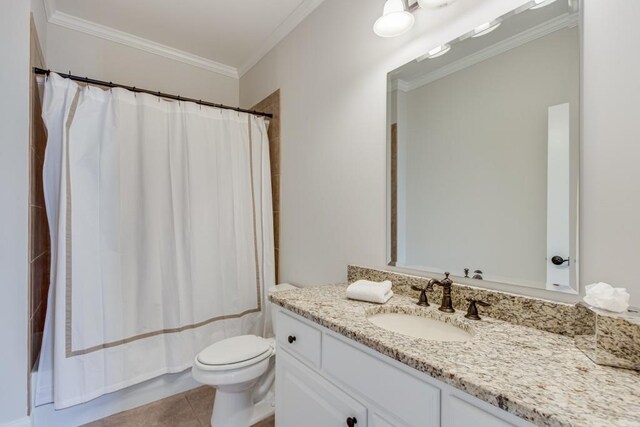 full bathroom with tile patterned floors, crown molding, shower / bath combination with curtain, toilet, and vanity