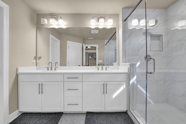 bathroom featuring vanity and an enclosed shower