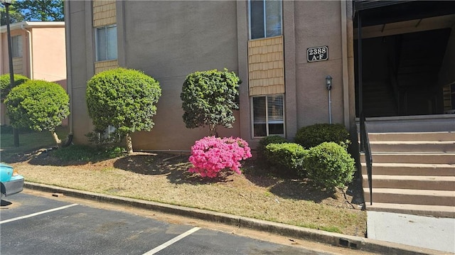 2388 Lawrenceville Hwy Unit D, Decatur, GA 30033 - property entrance featuring uncovered parking and stucco siding