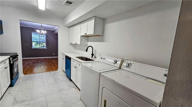 2388 Lawrenceville Hwy Unit D, Decatur, GA 30033 - laundry room with visible vents, an inviting chandelier, separate washer and dryer, a sink, and marble finish floor