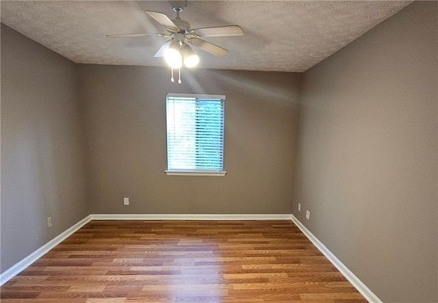 2388 Lawrenceville Hwy Unit D, Decatur, GA 30033 - empty room featuring ceiling fan, baseboards, wood finished floors, and a textured ceiling