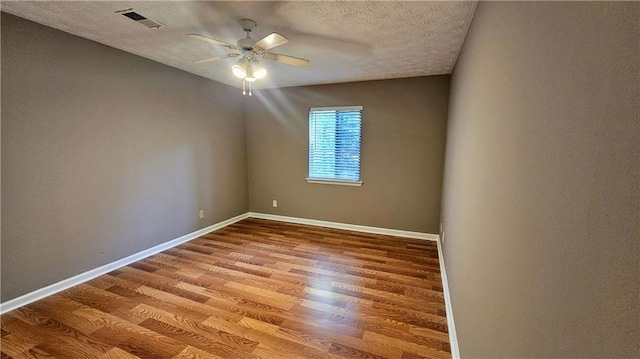 2388 Lawrenceville Hwy Unit D, Decatur, GA 30033 - unfurnished room with baseboards, a textured ceiling, light wood-style floors, visible vents, and ceiling fan