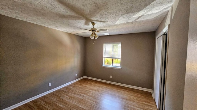 2388 Lawrenceville Hwy Unit D, Decatur, GA 30033 - spare room with ceiling fan, a textured ceiling, wood finished floors, and baseboards