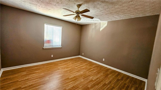 2388 Lawrenceville Hwy Unit D, Decatur, GA 30033 - empty room featuring a textured ceiling, wood finished floors, ceiling fan, and baseboards