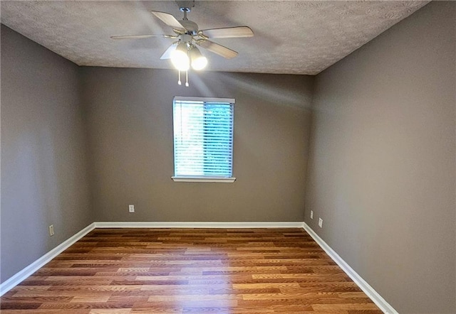 2388 Lawrenceville Hwy Unit D, Decatur, GA 30033 - unfurnished room featuring a textured ceiling, wood finished floors, baseboards, and a ceiling fan