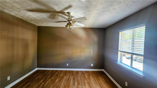 2388 Lawrenceville Hwy Unit D, Decatur, GA 30033 - spare room featuring dark wood-type flooring, baseboards, a textured ceiling, and ceiling fan