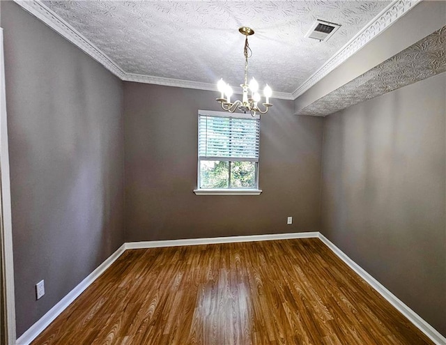 2388 Lawrenceville Hwy Unit D, Decatur, GA 30033 - empty room with crown molding, visible vents, baseboards, dark wood-style floors, and a notable chandelier