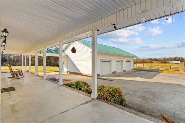 view of patio / terrace featuring a garage and an outdoor structure