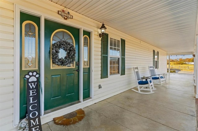 doorway to property featuring covered porch