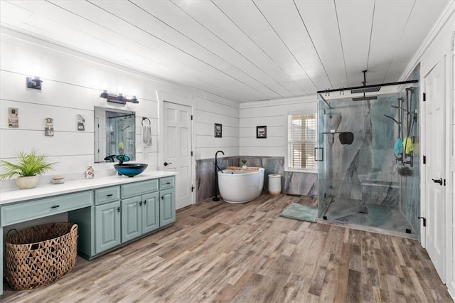 bathroom with wood-type flooring, vanity, wooden ceiling, and shower with separate bathtub