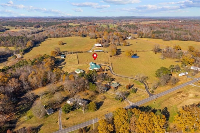 birds eye view of property with a rural view