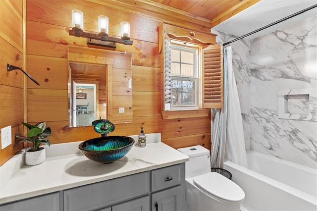 full bathroom with vanity, wood walls, wooden ceiling, toilet, and shower / bath combo with shower curtain