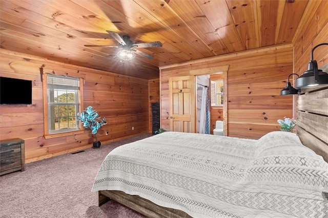 bedroom with carpet flooring, wood walls, ceiling fan, and wooden ceiling