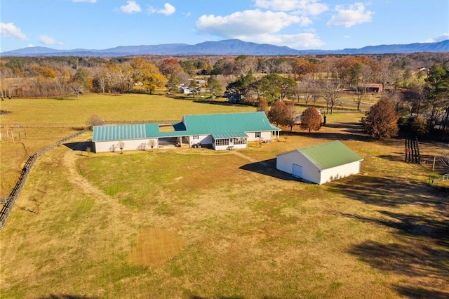 drone / aerial view featuring a mountain view and a rural view