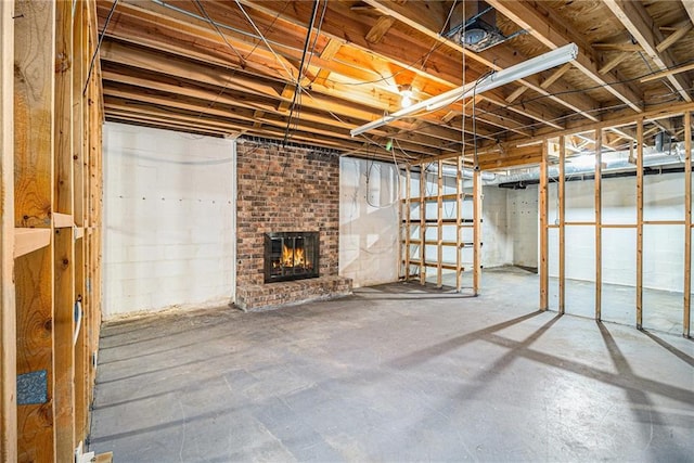 unfinished basement with a fireplace