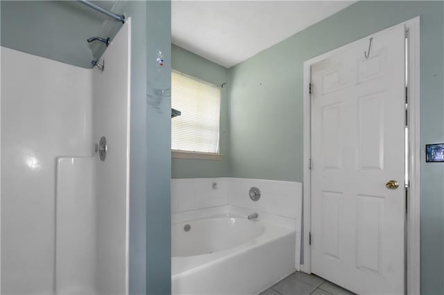 9550 Canvasback Ct, Jonesboro, GA 30238 - bathroom with tile patterned floors, a bath, and a shower