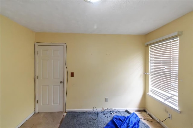 9550 Canvasback Ct, Jonesboro, GA 30238 - spare room featuring plenty of natural light, baseboards, and light colored carpet