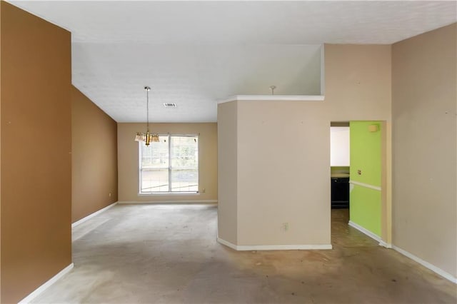 9550 Canvasback Ct, Jonesboro, GA 30238 - empty room with baseboards, a chandelier, and concrete floors