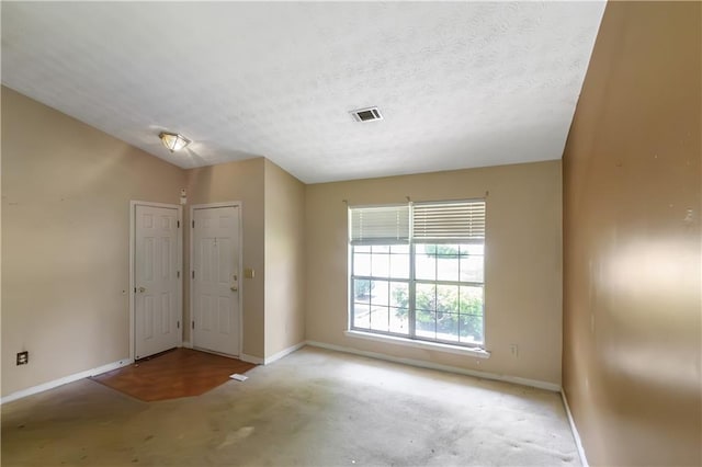 9550 Canvasback Ct, Jonesboro, GA 30238 - empty room featuring baseboards, carpet floors, and a textured ceiling