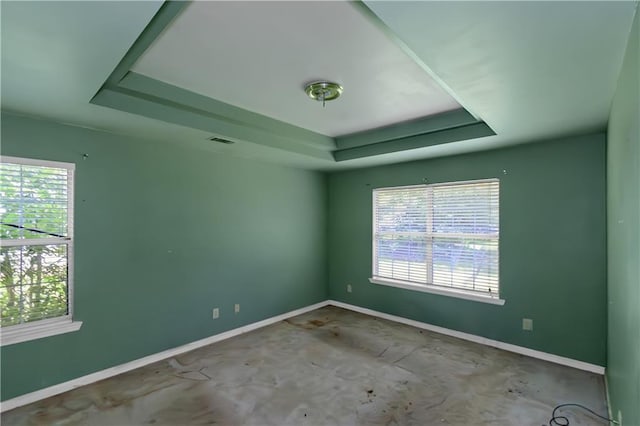 9550 Canvasback Ct, Jonesboro, GA 30238 - empty room with a raised ceiling, plenty of natural light, and baseboards