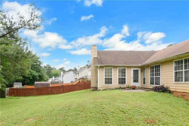 9550 Canvasback Ct, Jonesboro, GA 30238 - back of property featuring a chimney