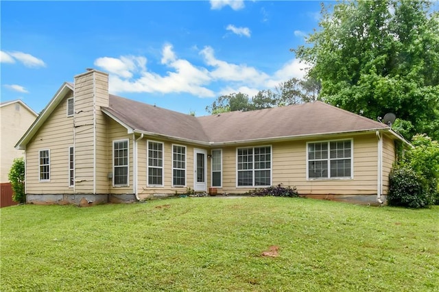 9550 Canvasback Ct, Jonesboro, GA 30238 - rear view of property with a chimney and a lawn
