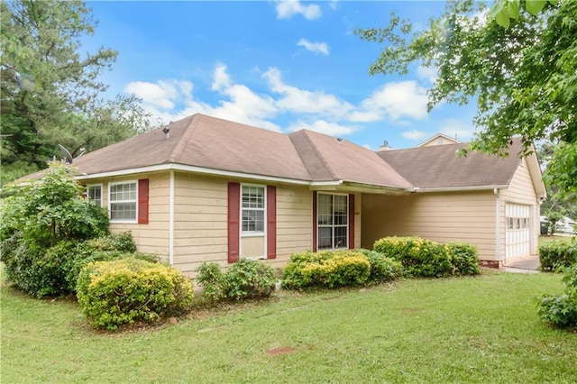 9550 Canvasback Ct, Jonesboro, GA 30238 - view of front of house featuring an attached garage and a front lawn