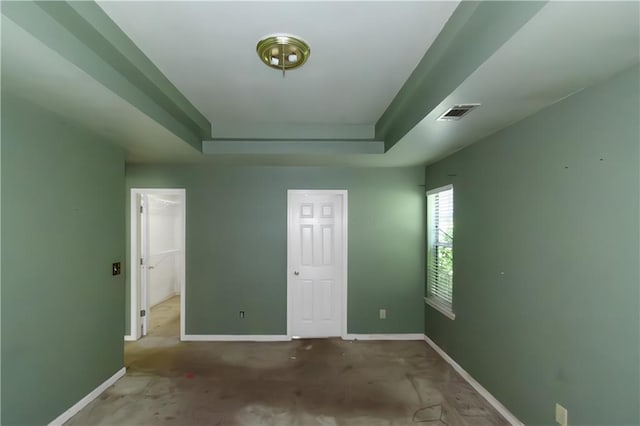 9550 Canvasback Ct, Jonesboro, GA 30238 - unfurnished bedroom with baseboards, a raised ceiling, and a closet