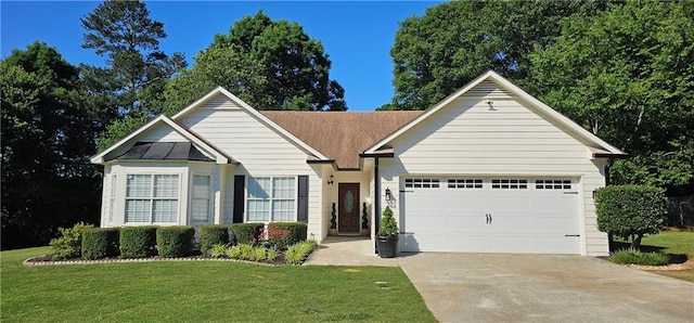 479 Cedar Trl, Winder, GA 30680 - view of front of home with driveway, an attached garage, and a front lawn