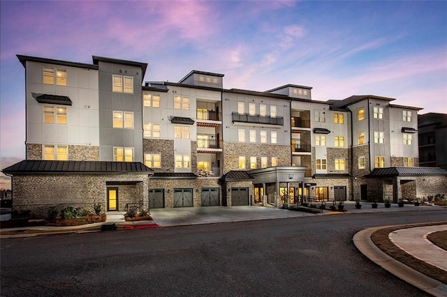3351 Orwell Way Unit 2305, Cumming, GA 30041 - view of building exterior featuring an attached garage and concrete driveway