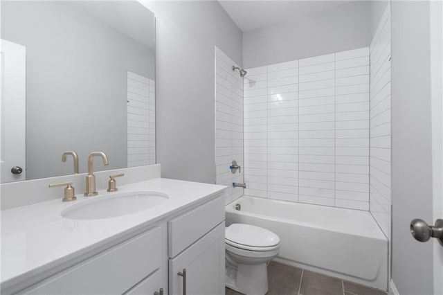 full bath featuring toilet, tile patterned floors, tub / shower combination, and vanity