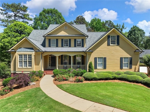 4523 Warwick Glen Pl, Flowery Branch, GA 30542 - traditional-style home with a porch, a front yard, and roof with shingles