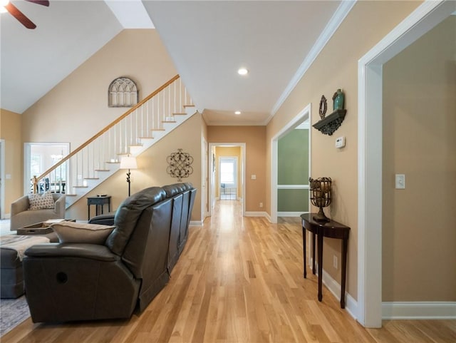 4523 Warwick Glen Pl, Flowery Branch, GA 30542 - living area with stairway, light wood-style floors, a ceiling fan, baseboards, and crown molding
