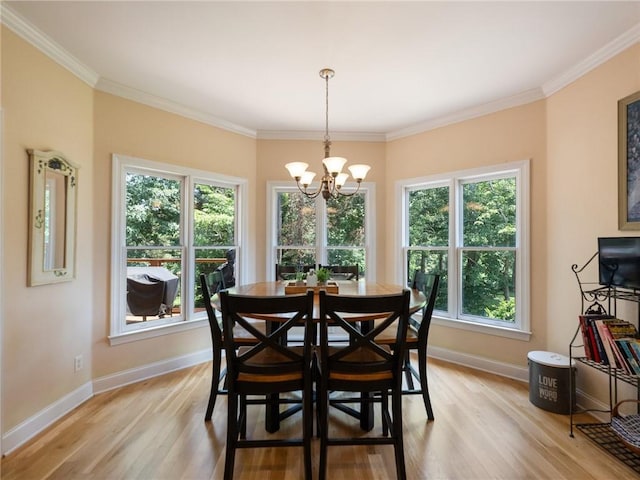 4523 Warwick Glen Pl, Flowery Branch, GA 30542 - dining room with light wood-type flooring, a chandelier, crown molding, and baseboards