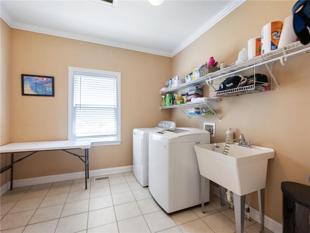 4523 Warwick Glen Pl, Flowery Branch, GA 30542 - laundry area with ornamental molding, separate washer and dryer, baseboards, and light tile patterned floors