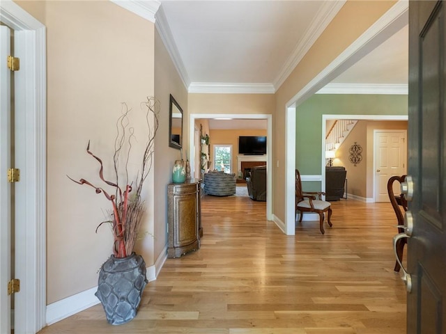 4523 Warwick Glen Pl, Flowery Branch, GA 30542 - foyer with light wood-type flooring, crown molding, and baseboards