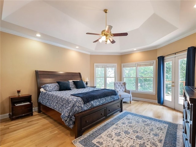 4523 Warwick Glen Pl, Flowery Branch, GA 30542 - bedroom with a raised ceiling, light wood-type flooring, access to exterior, ornamental molding, and french doors