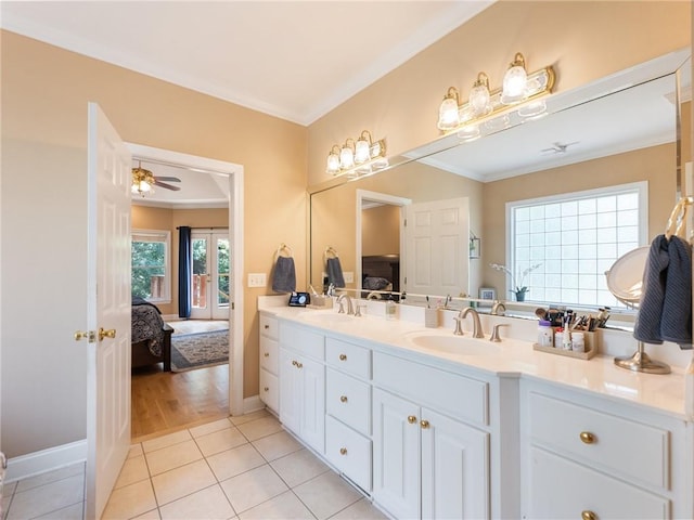 4523 Warwick Glen Pl, Flowery Branch, GA 30542 - ensuite bathroom featuring crown molding, tile patterned flooring, double vanity, and baseboards