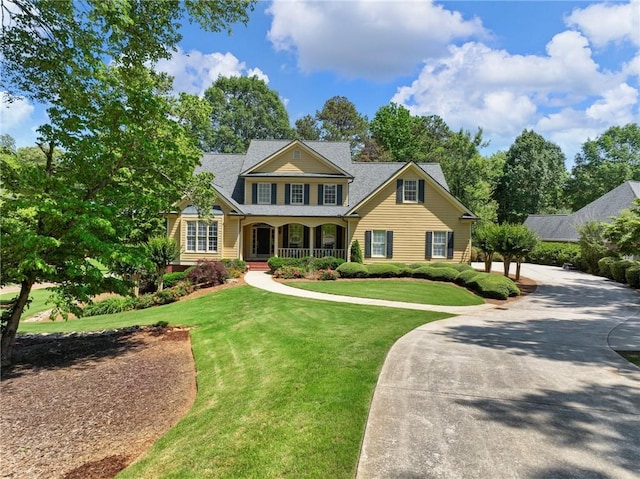 4523 Warwick Glen Pl, Flowery Branch, GA 30542 - view of front of house with a porch and a front yard