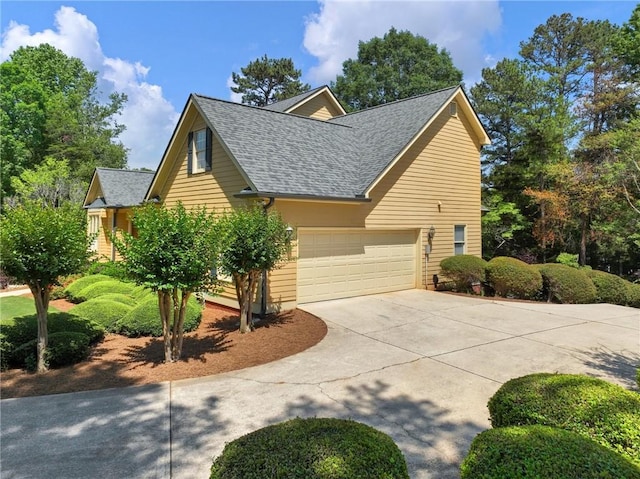 4523 Warwick Glen Pl, Flowery Branch, GA 30542 - view of side of home featuring concrete driveway, roof with shingles, and a garage