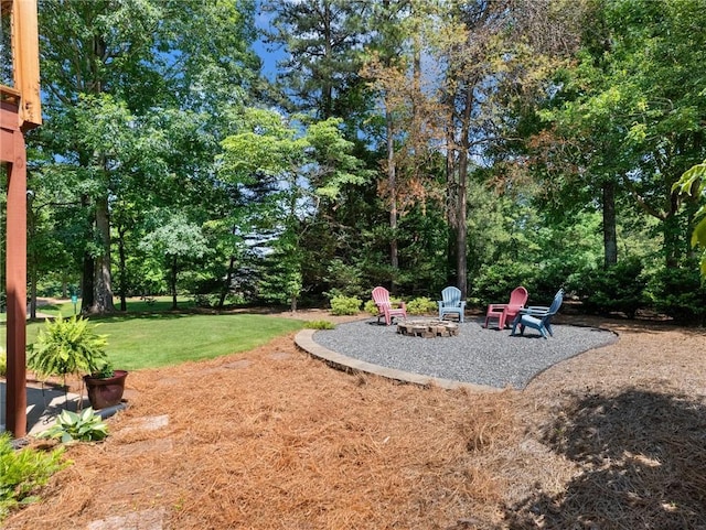 4523 Warwick Glen Pl, Flowery Branch, GA 30542 - view of green lawn featuring an outdoor fire pit and a patio