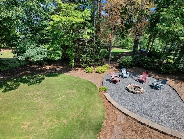 4523 Warwick Glen Pl, Flowery Branch, GA 30542 - view of green lawn featuring a fire pit and a patio