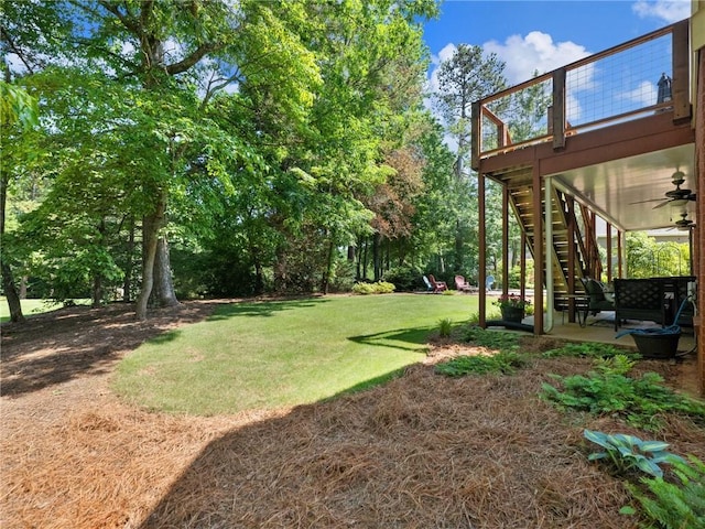 4523 Warwick Glen Pl, Flowery Branch, GA 30542 - view of green lawn featuring ceiling fan, stairway, and a patio area