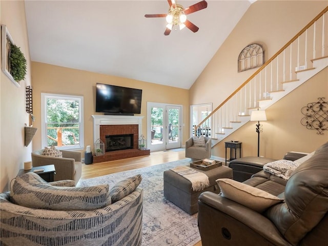 4523 Warwick Glen Pl, Flowery Branch, GA 30542 - living area with plenty of natural light, stairway, high vaulted ceiling, wood finished floors, and ceiling fan