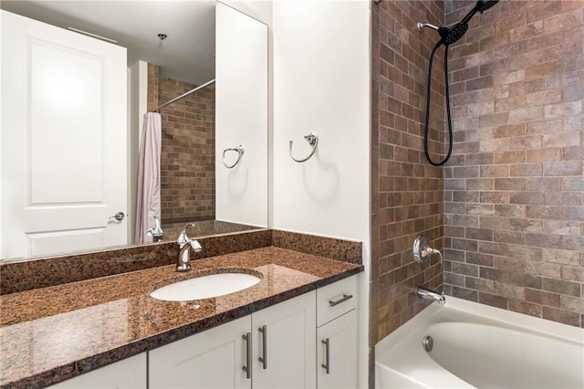 bathroom featuring shower / bath combo with shower curtain and vanity